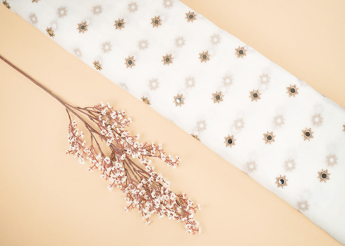 White Georgette Dyeable Fabric With All Over Buti Of Golden Zari And Faux Mirror Work PG 22409