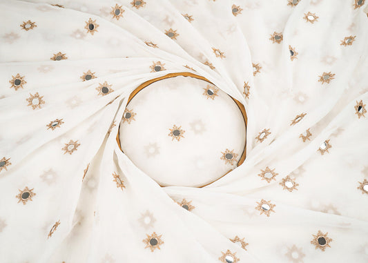 White Georgette Dyeable Fabric With All Over Buti Of Golden Zari And Faux Mirror Work PG 22409