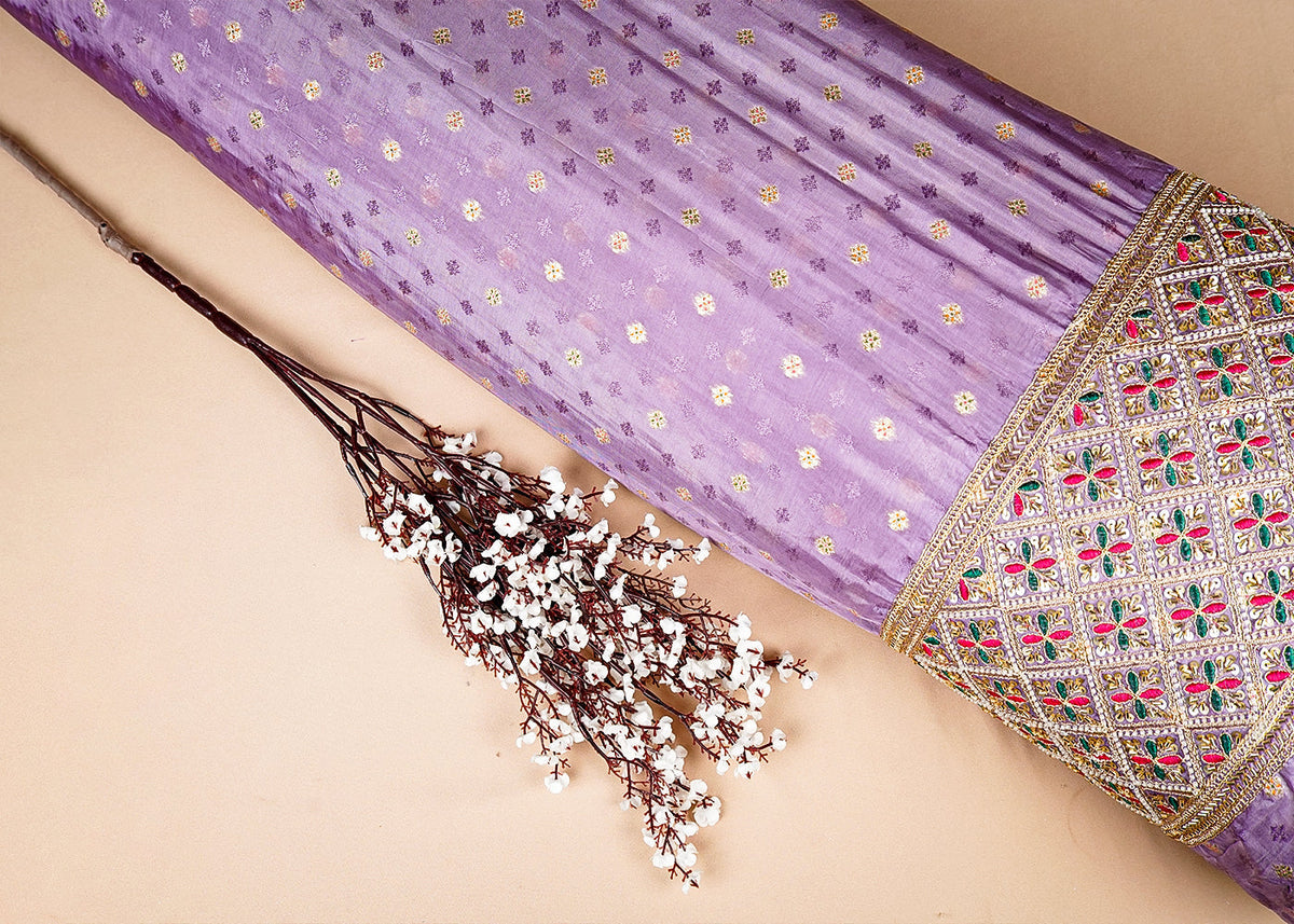 Lavender Silk Fabric With All Over Zari Buti With One Side Zari, Thread and Sequins Work Border PG 16001